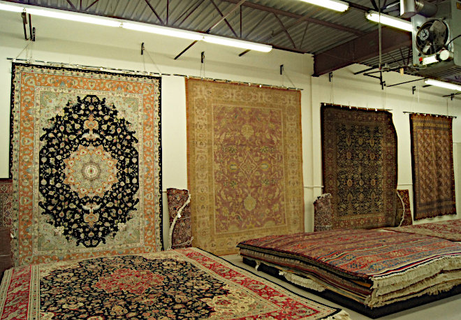 A wide selection of beautiful Persian rugs displayed in the showroom at Kurosh Persian Rugs in Bloomington, MN.