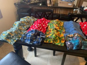 A person in yellow boots using a professional machine to clean a large oriental rug at Dave's Magikist, Inc. in Milwaukee, WI.