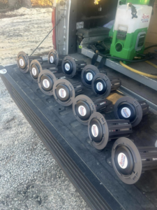 Multiple pest control bait stations and equipment in a truck bed for Adams Pest and Termite Control in Austin, TX.