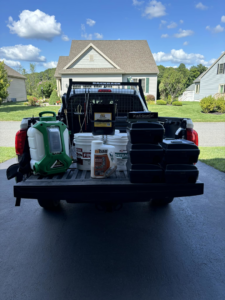 A Sheridan Pest Control truck loaded with various pest control equipment for services in Albany, NY.
