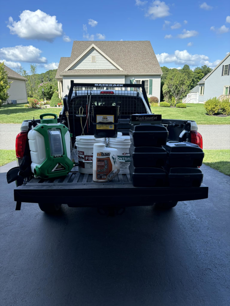 A Sheridan Pest Control truck loaded with various pest control equipment for services in Albany, NY.