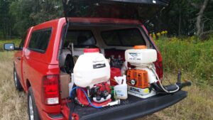 Pest control equipment, including sprayers and a fogger, loaded in a truck bed for Spectrum Pest Control Eco-Tech LLC in Kenosha, WI.