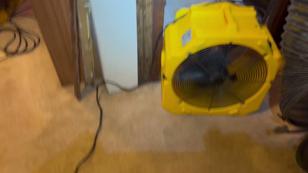 A large yellow fan, part of the heat treatment equipment for pest control, used by Northwest Bedbug Company in Spokane, WA.