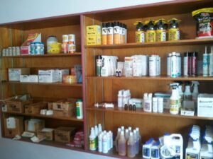 Shelves stocked with various pest control products and supplies at Franklin Pest Solutions Michigan City in Lafayette, IN.