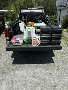Close-up of Sheridan Pest Control truck bed with Niban bait, sprayer, and rodent stations in Albany, NY.