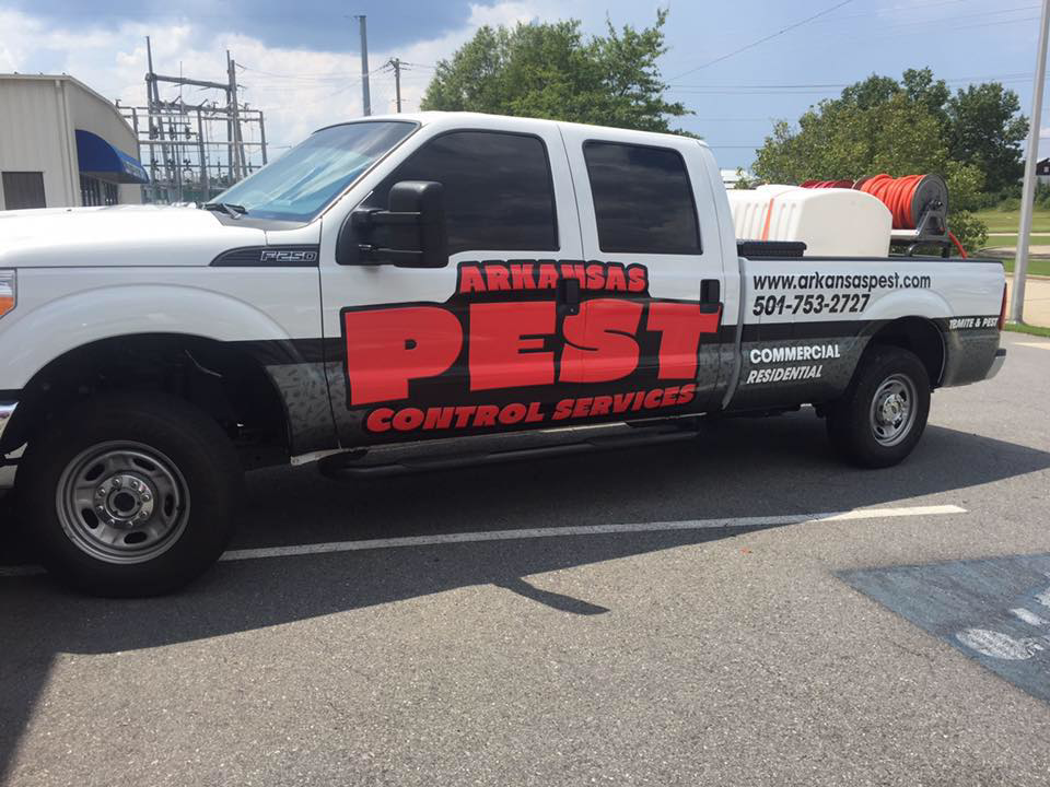 A branded pest control service truck with equipment for Arkansas Pest Control Services in North Little Rock, AR.