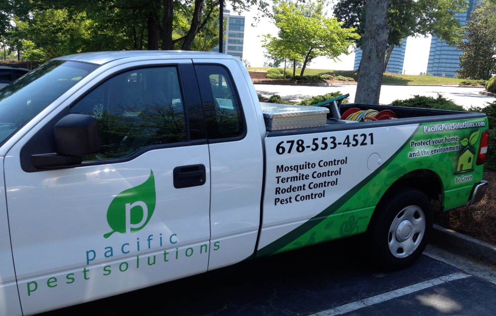 A Pacific Pest Solutions service truck with equipment in Alpharetta, GA, ready for pest and wildlife control jobs.