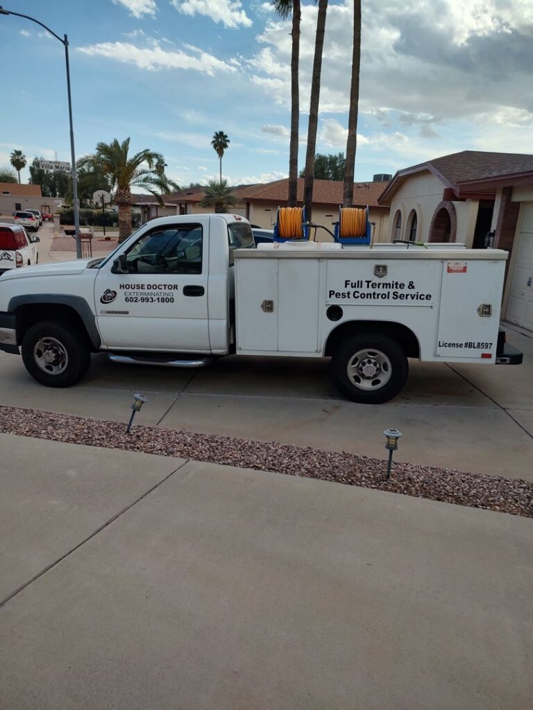 A House Doctor Exterminating service truck with "Full Termite & Pest Control Service" displayed in Glendale, AZ.