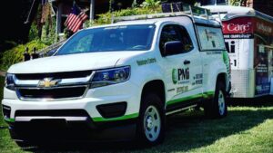 A Pest Management Systems, Inc. service truck and trailer for pest and moisture control in Greensboro, NC