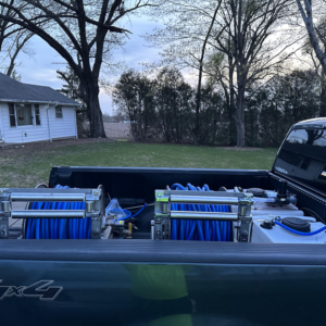 Pest control spray equipment with blue hoses and tanks loaded in a truck bed for Pest Express Pest & Termite Control in Cedar Rapids, IA