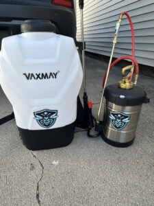 Pest control backpack and handheld sprayers with the company logo, ready for service by Perimeter Pest Control DSM in Des Moines, IA