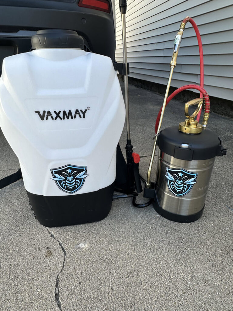 Pest control backpack and handheld sprayers with the company logo, ready for service by Perimeter Pest Control DSM in Des Moines, IA