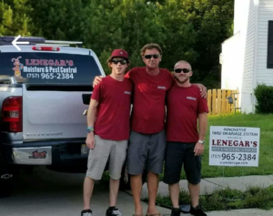 The dedicated team from Lenegar's Pest & Moisture Services with their truck and sign in Virginia Beach, VA.