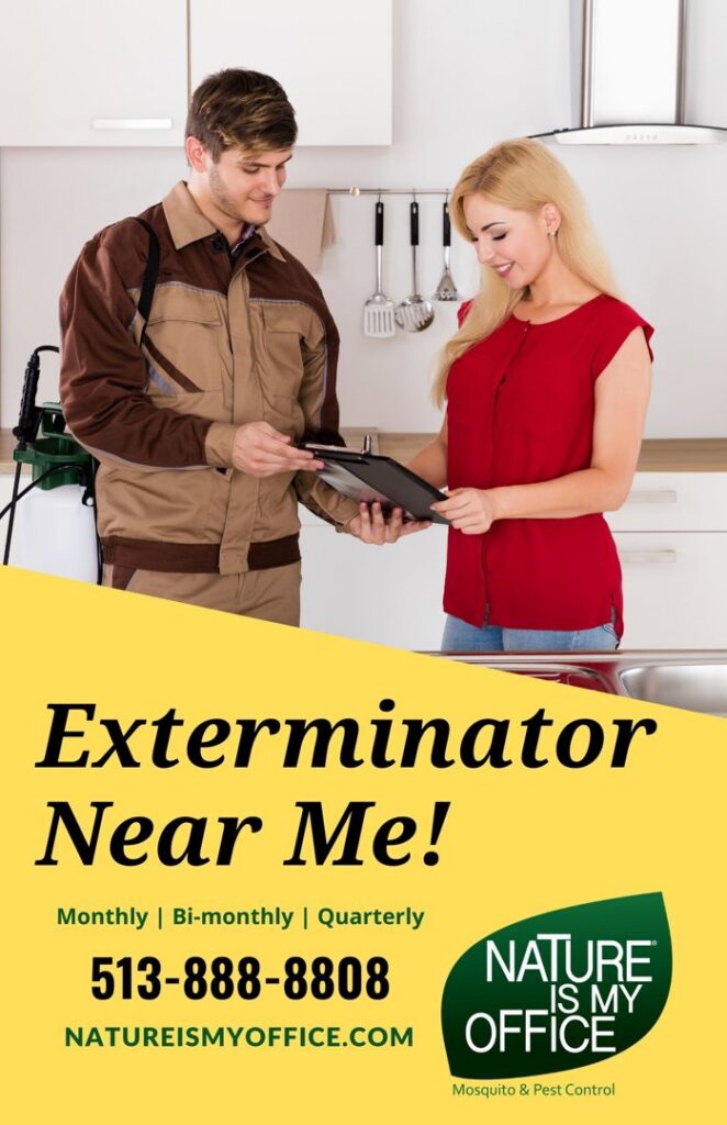 A Nature Is My Office LLC pest control technician consulting with a client in a kitchen in Cincinnati, OH.