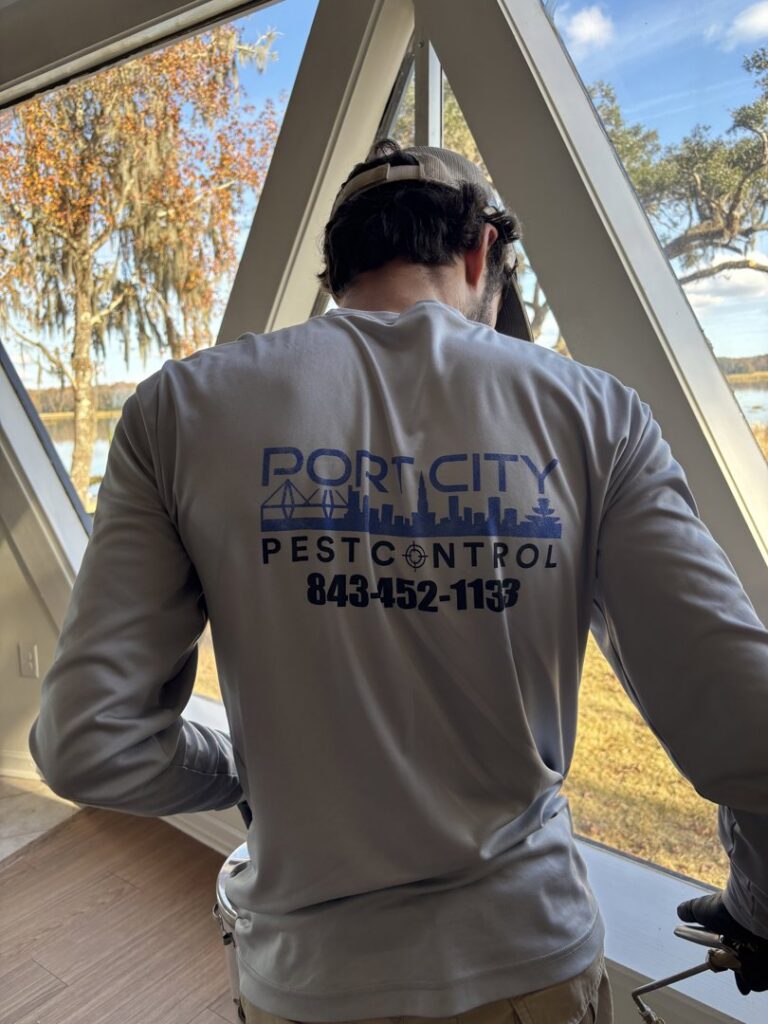 A Port City Pest Control technician inspecting a home interior during a pest control service in Summerville, SC.