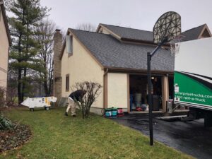 A pest control technician preparing a heat treatment setup for a home by Protective Thermal Solutions in Columbus, OH.