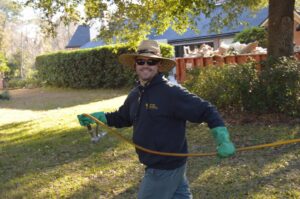 A Pro Care Lawn and Pest technician performing a spray treatment for pest control in Jacksonville, FL.