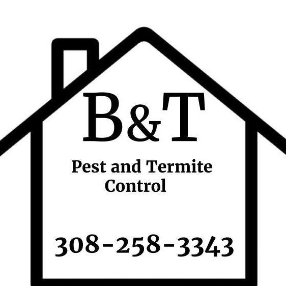 A pest control technician spraying a building's foundation for B&T Termite & Pest Control, Inc. in Lincoln, NE.