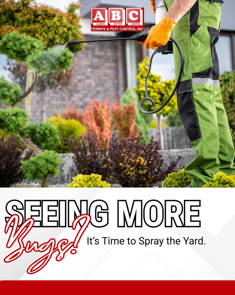 A pest control technician from ABC Termite & Pest Control, Inc spraying bushes in a residential yard in Lincoln, NE.