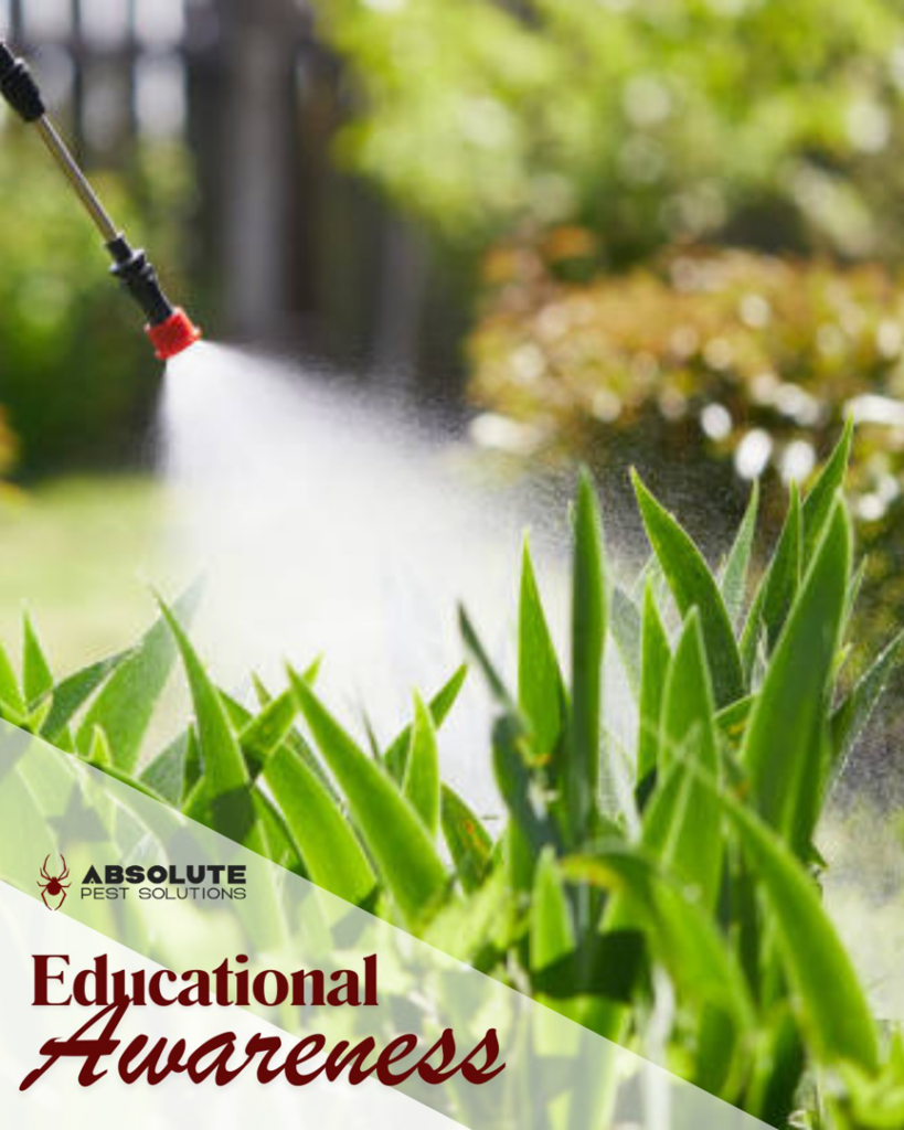 A pest control technician spraying plants in a garden as part of a service by Absolute Pest Solutions in Piedmont, OK.