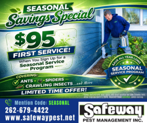 A Safeway Pest Management technician spraying the exterior of a house for pest control in Muskego, WI.
