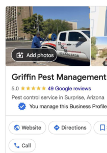 A pest control technician with a Griffin Pest Management truck in Surprise, AZ, preparing for a service.