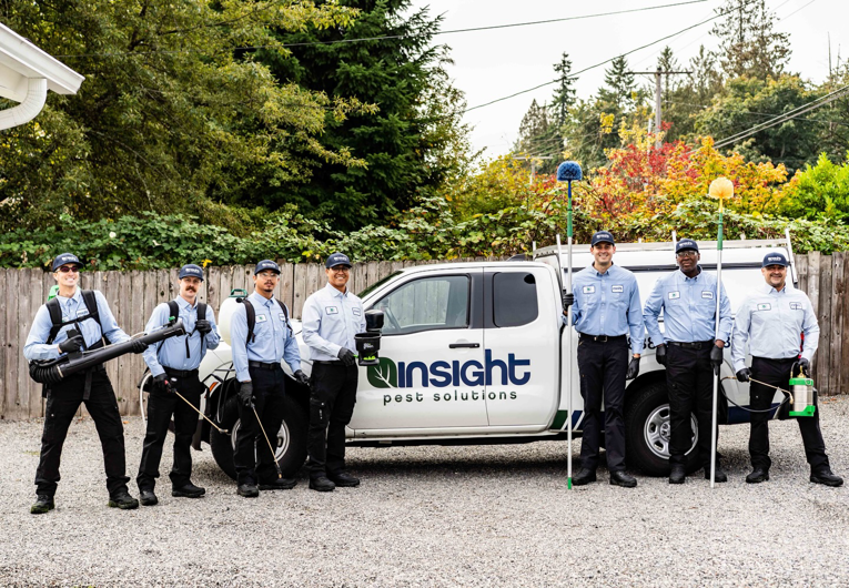 A team of pest control technicians with their equipment and branded truck from Insight Pest Solutions- Northwest in Federal Way, WA.
