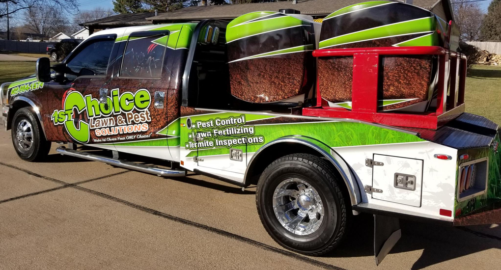A branded pest control truck from 1st Choice Lawn & Pest Solutions, ready for service in Hastings, NE.