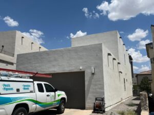 An El Valle Pest Control truck parked in front of a residential building, ready for service in El Paso, TX