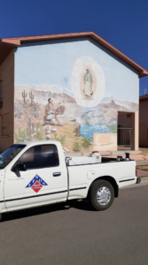 An Epson Pest Control truck with pest control equipment in the bed, parked in El Paso, TX.