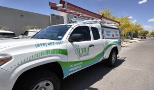 A branded El Valle Pest Control truck with ladders on the roof, ready for service in El Paso, TX