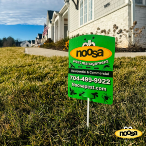 A Noosa Pest Management, LLC yard sign indicating residential and commercial services in Columbia, SC.