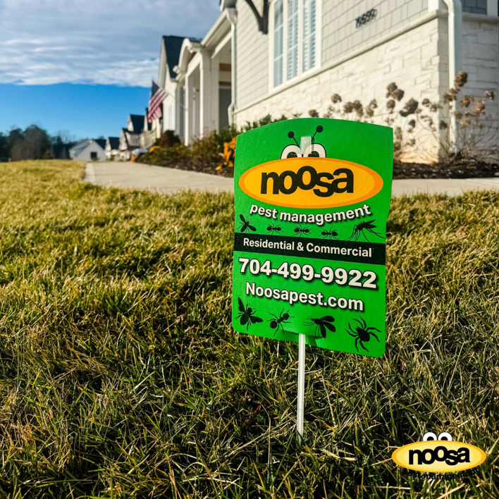 A Noosa Pest Management, LLC yard sign indicating residential and commercial services in Columbia, SC.