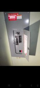 An electrical panel for a photovoltaic system with a service disconnect, installed by ANT POWER LLC in Tacoma, WA.