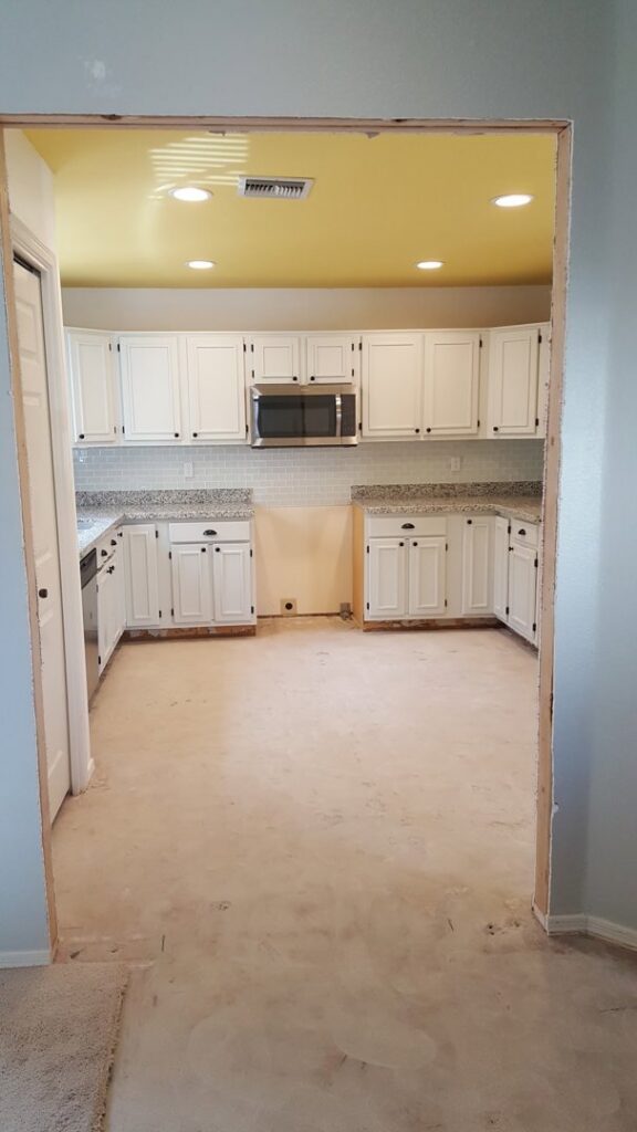 A pickup truck loaded with rolled carpet for removal or installation by Arizona Home Floors Dust Free Tile Removal in Tempe, AZ.