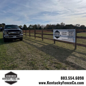 A black pickup truck parked next to a newly installed wooden fence by Kentucky Fence Co in McConnells, SC.