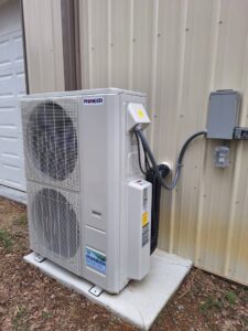 A Pioneer mini-split condenser unit installed outside a building by Recovery HVAC in Smyrna, TN.