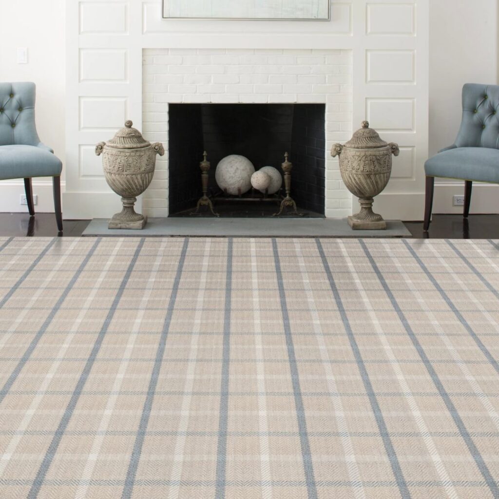 A cozy living room featuring a large plaid area rug, available at Morency Flooring in New Bedford, MA.