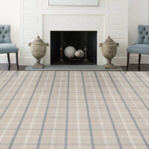 A cozy living room featuring a large plaid area rug, available at Morency Flooring in New Bedford, MA.