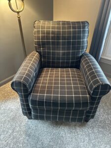 A clean plaid upholstered armchair on a freshly cleaned carpet by Fiber Dry Carpet & Upholstery Cleaning in Dayton, OH.