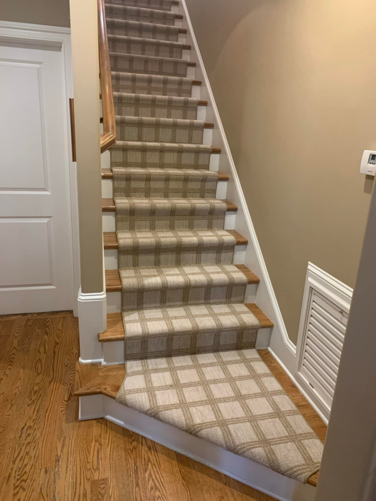 A beautifully installed plaid carpet stair runner by The Carpet Workroom in Needham Heights, MA.