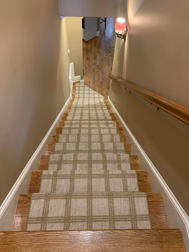 Overhead view of a plaid carpet stair runner installed by The Carpet Workroom in Needham Heights, MA.
