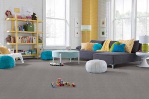 A modern playroom with new grey carpet installed by Pape's Flooring America in Pittsburgh, PA