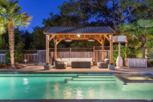 Outdoor pool area with illuminated pergola and landscape lighting installed by R.C Electric, Inc. in San Francisco, CA