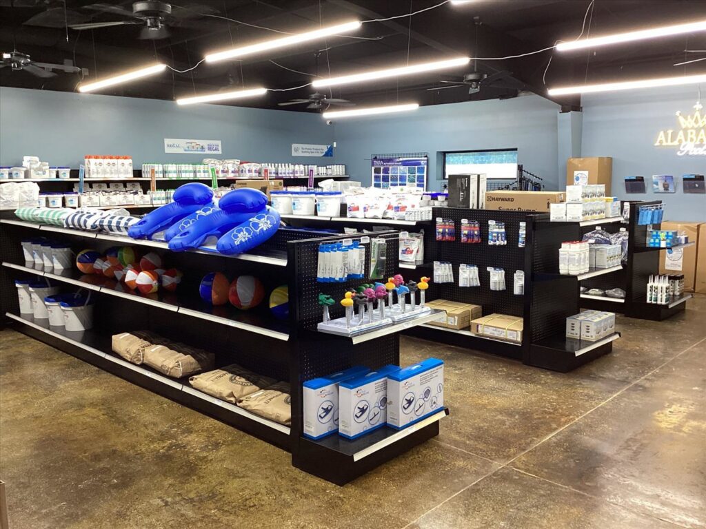 Shelves stocked with pool chemicals and equipment at Alabama Pool Kings, a pool cleaner business in Madison, AL.