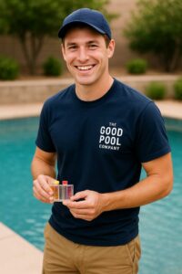 A pool cleaner from The Good Pool Company testing pool water with chemical vials in Scottsdale, AZ.