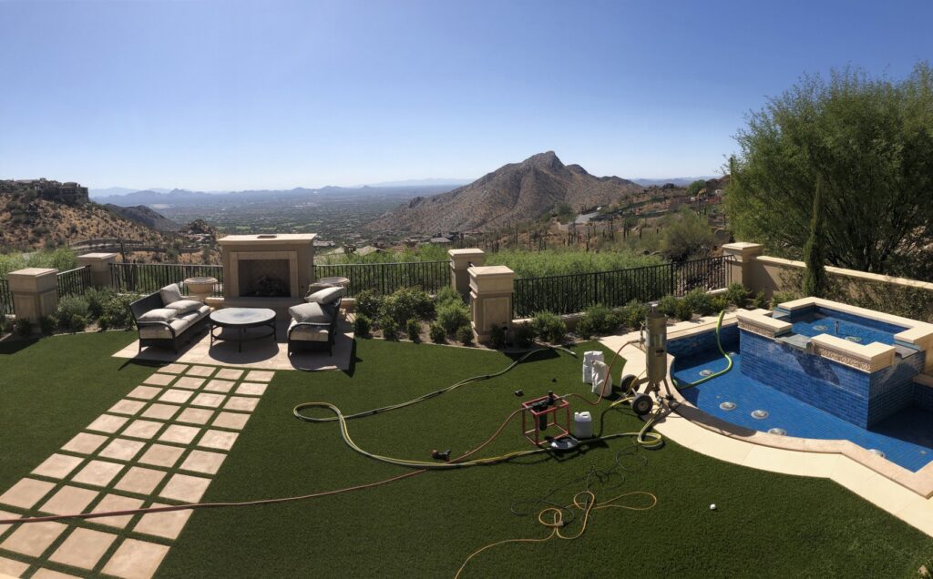 Pool cleaning equipment, including hoses and a pump, set up next to a clean pool by AZ Pool Love in Mesa, AZ, indicating a recent service