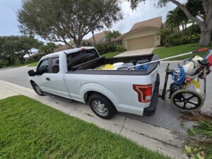 A Summer Breeze Pool Services truck loaded with professional pool cleaning equipment in Glendale, AZ