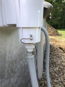 Electrical grounding wire connected to pool equipment, demonstrating safe installation by Surge Electric LLC in Youngstown, OH.