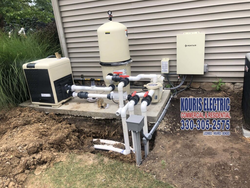 Electrical hookup and wiring for pool equipment, including pumps and heaters, completed by Kouris Electric LLC in Canton, OH.